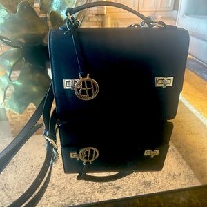 Henri Bendel black purse , beautiful leather and sturdy with adjustable handle